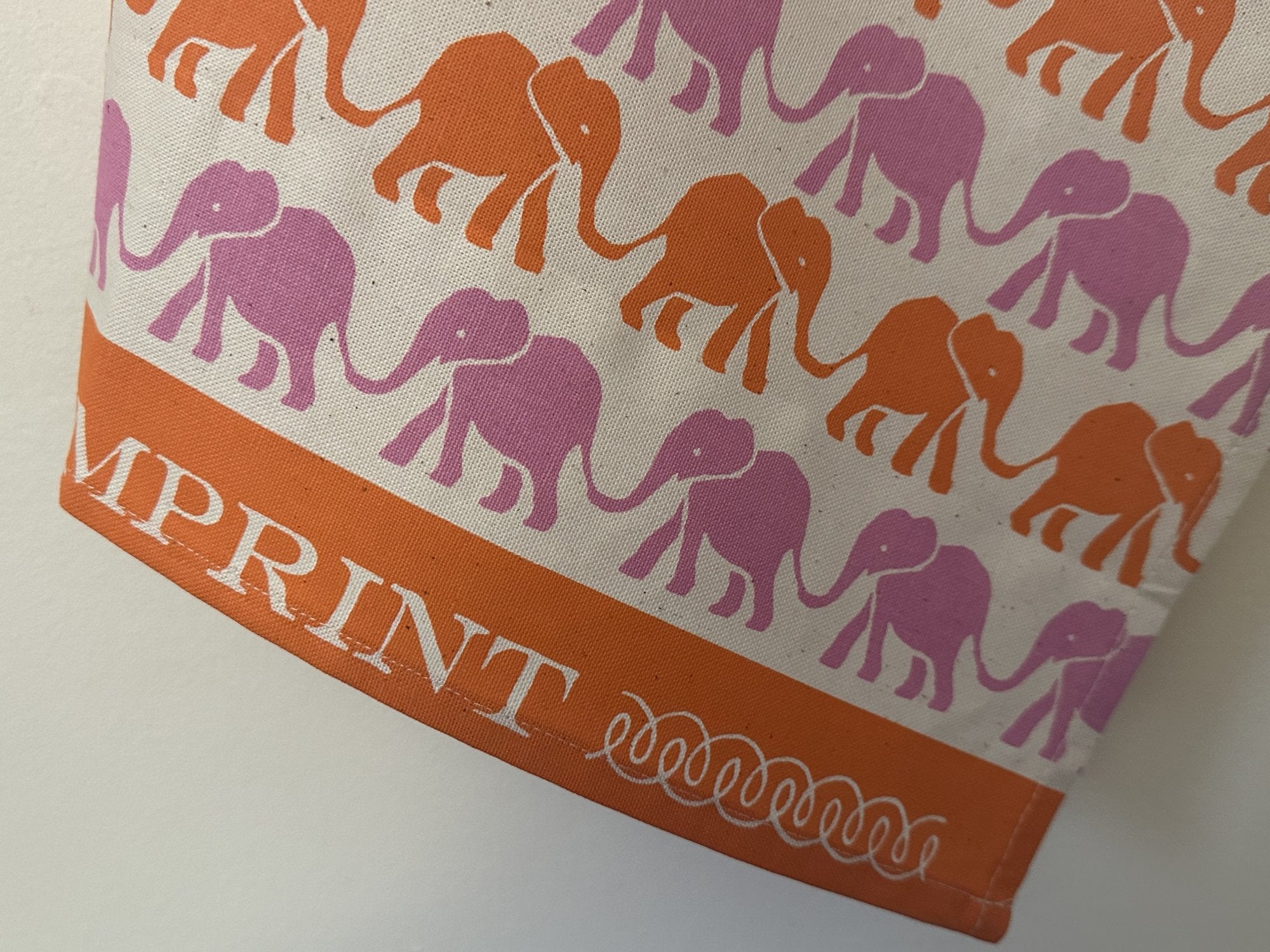 Cambridge Imprint "Elephants Pink & Orange", Pure cotton tea towel. Printed in the UK.