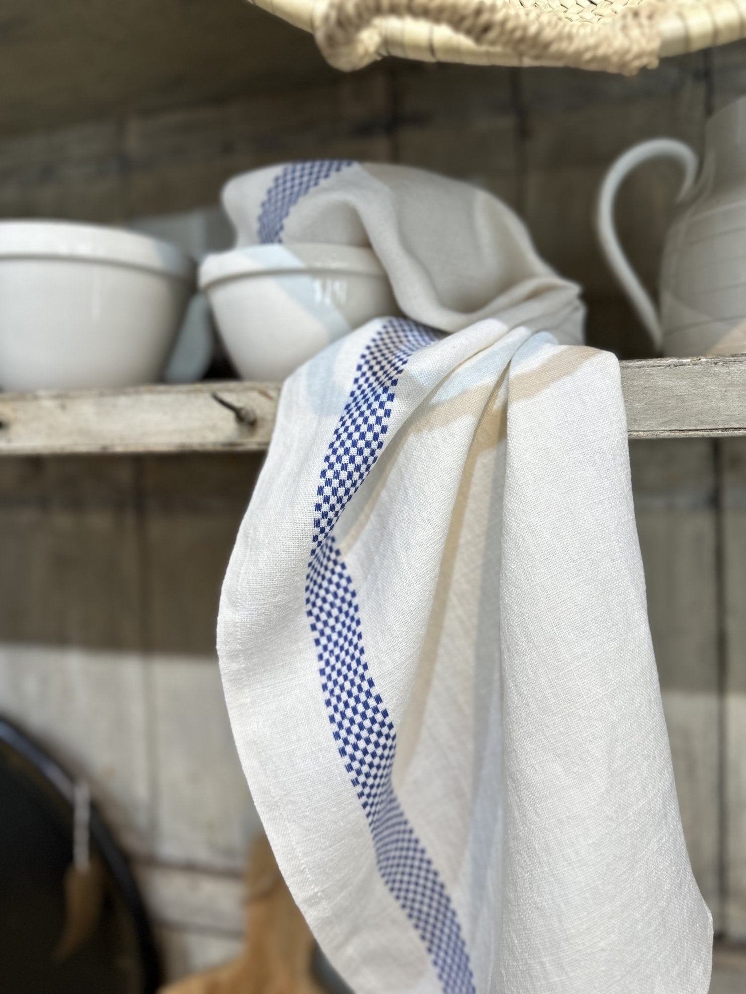 Charvet Editions "Lustucru" (Blue), White woven linen tea towel. Made in France.